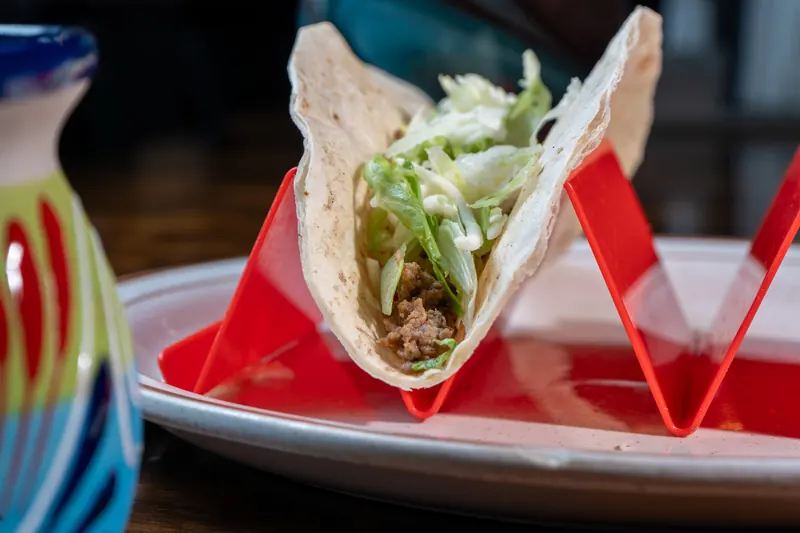 Soft tacos in a red taco holder