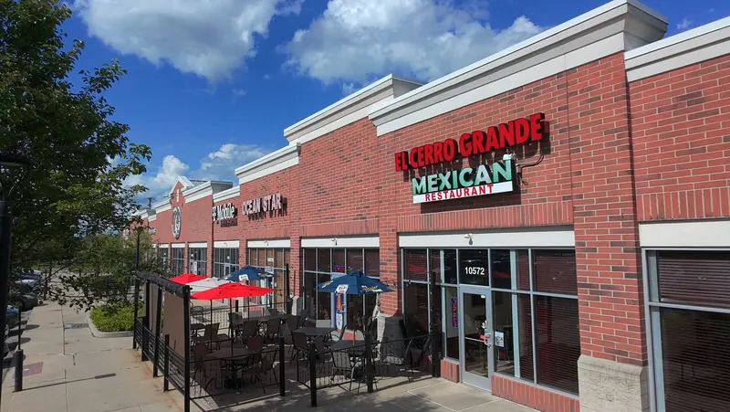 The El Cerro Grande storefront and patio on a sunny day